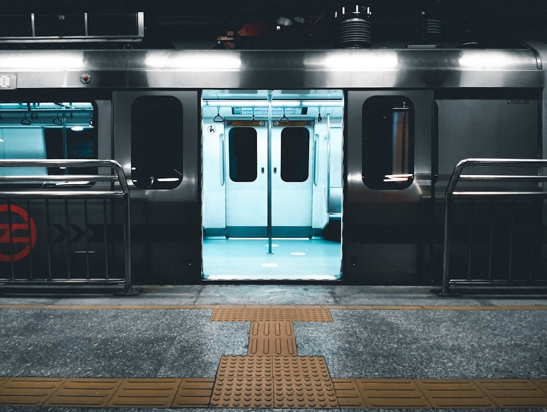 Commuters walking through a metro station platform in Santiago