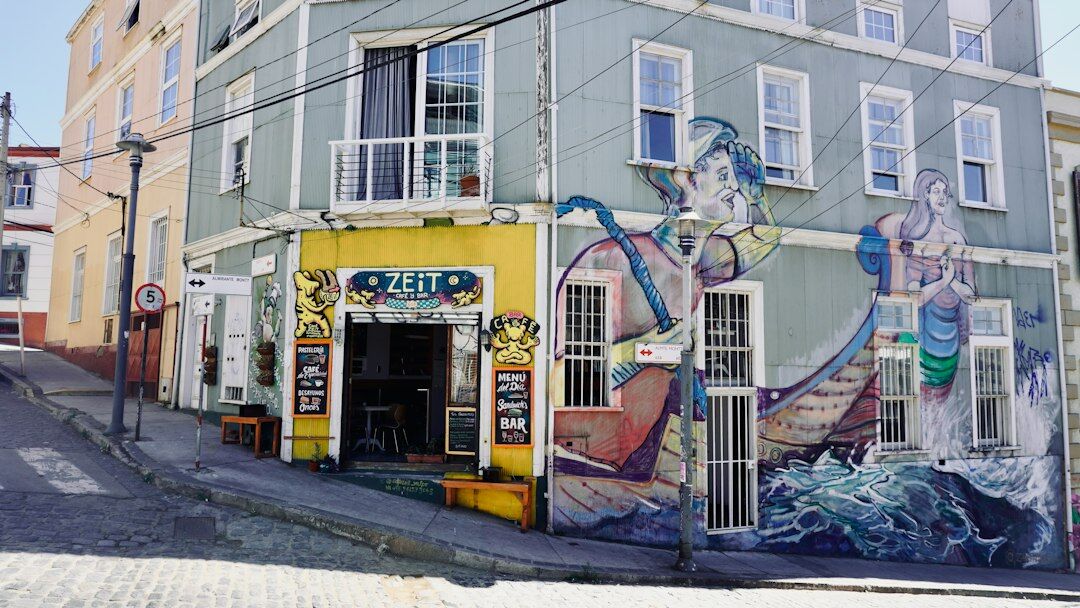 Large street art mural on a building wall in Valparaíso